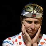 Tadej Pogacar (UAE Team Emirates) on the podium as he receives the best climber