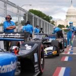 Race car diver Scott McLaughlin gets out of his car after a qualifying race prior to Sunday's Freedom 250 Grand Prix auto