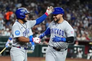 Chicago Cubs' Michael Conforto, right, celebrates his two-run home run against the Arizona Diamondbacks with Cubs' Pedro