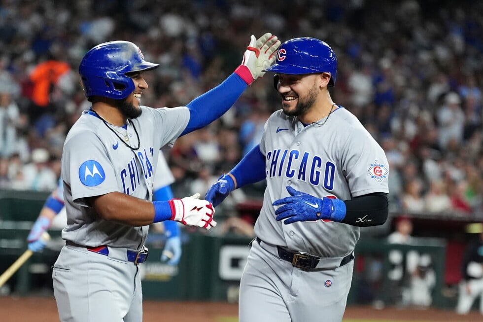 Chicago Cubs' Michael Conforto, right, celebrates his two-run home run against the Arizona Diamondbacks with Cubs' Pedro