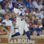 Chicago Cubs' Dansby Swanson hits a home run during the third inning of a baseball game against the Los Angeles Dodgers