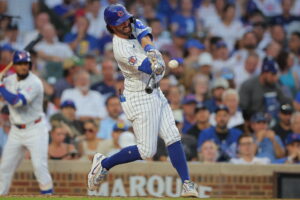 Chicago Cubs' Dansby Swanson hits a home run during the third inning of a baseball game against the Los Angeles Dodgers