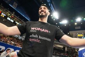Former NBA center Enes Kanter Freedom greets a friend before a WNBA basketball game between the Indiana Fever and the