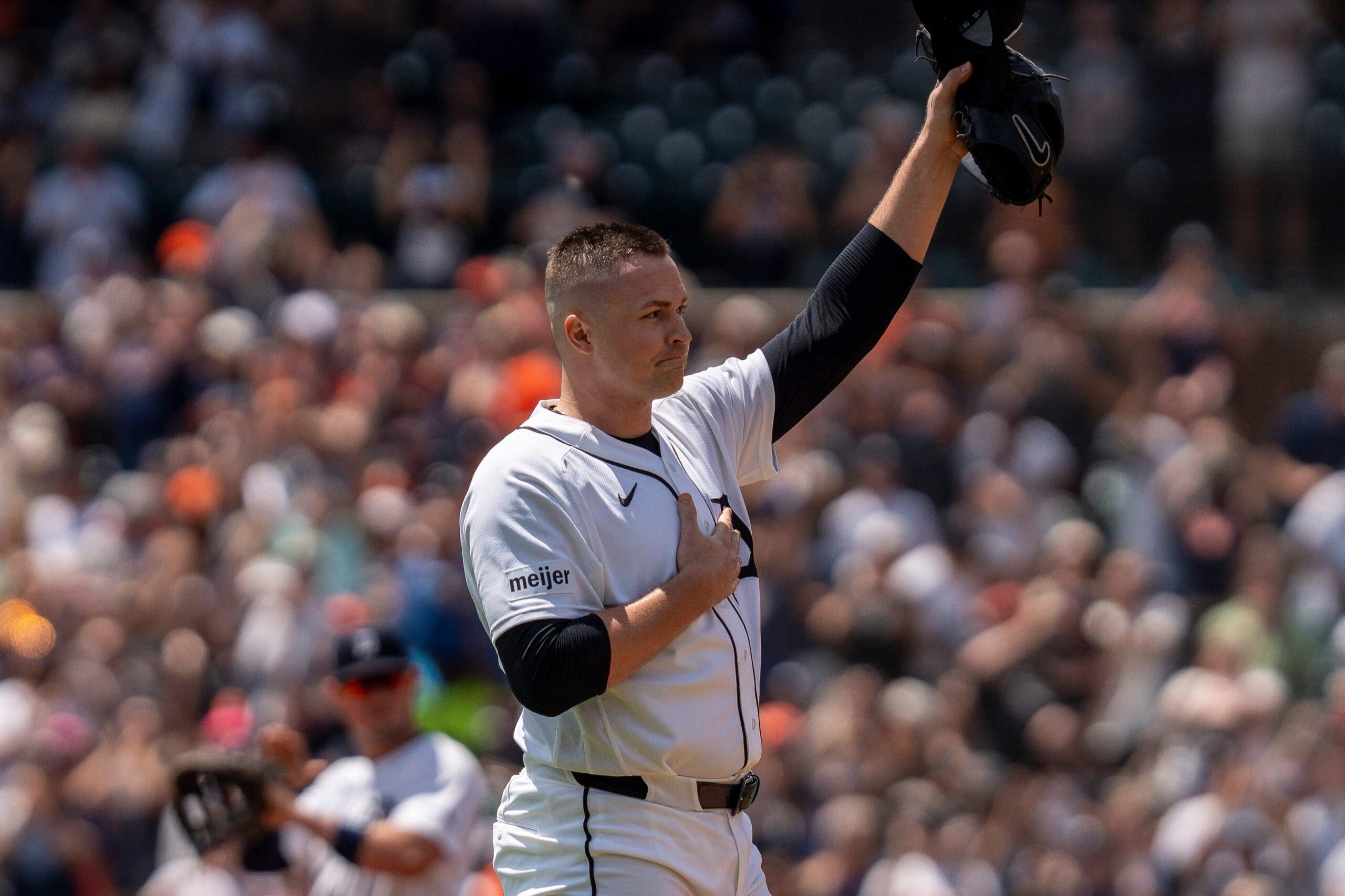 Detroit Tigers pitcher Tarik Skubal tipping his hat to fans after his 1,000th strikeout