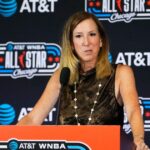 WNBA Commissioner Cathy Engelbert stands at a podium and talks to media before the WNBA All-Star Game on July 25