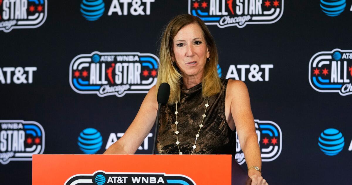 WNBA Commissioner Cathy Engelbert stands at a podium and talks to media before the WNBA All-Star Game on July 25