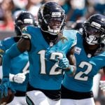 Jaguars cornerback Travis Hunter celebrates with teammates against New England Patriots