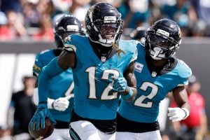 Jaguars cornerback Travis Hunter celebrates with teammates against New England Patriots