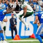 New York Jets tight end Kenyon Sadiq (16) runs against Detroit Lions cornerback D.J. Reed (4) during the second half at Ford