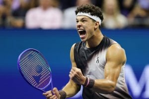 Ben Shelton, of the United States, celebrates after a point in the fifth set against Carlos Alcaraz, of Spain, during the