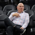 Los Angeles Clippers owner Steve Ballmer sits on the sideline before an NBA basketball game against the Chicago Bulls on