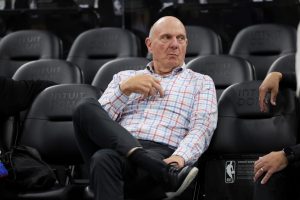 Los Angeles Clippers owner Steve Ballmer sits on the sideline before an NBA basketball game against the Chicago Bulls on