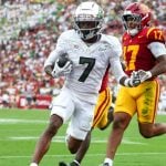Los Angeles , CA - September 26: Oregon wide receiver Evan Stewart (7) runs into