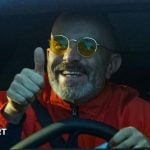 Manchester City manager Enzo Maresca gives a thumbs-up as he arrives at the City Football Academy in his car