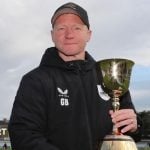 Gareth Batty in Surrey hoodie holding the County Championship trophy