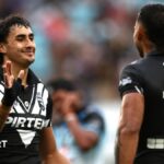 Casey McLean celebrates after scoring a try for New Zealand