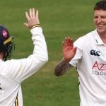 Brydon Carse high-fives a Durham team-mate
