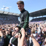 Fabian Hurzeler celebrates St Pauli's promotion to the Bundesliga with fans in 2024