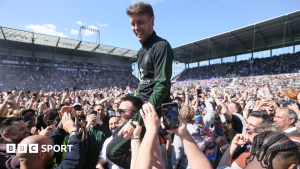 Fabian Hurzeler celebrates St Pauli's promotion to the Bundesliga with fans in 2024