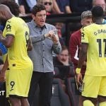 Brentford boss Keith Andrews speaks with his players on the touchline during a break in play in the Premier League match